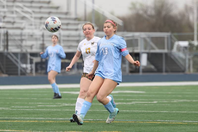 Plainfield South’s Arabella Gaudiuso clears the ball away from Joliet West’s Hannah Rasmussen on Thursday, April 18, 2024.