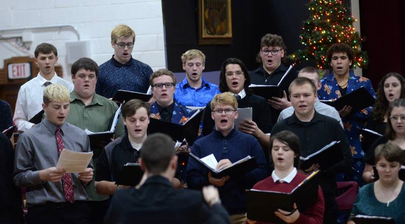 Oregon High School Choir members sing a selection under the direction of  Zach Hall at the OHS Christmas Concert held Sunday, Dec. 17, 2023 at Oregon High School.