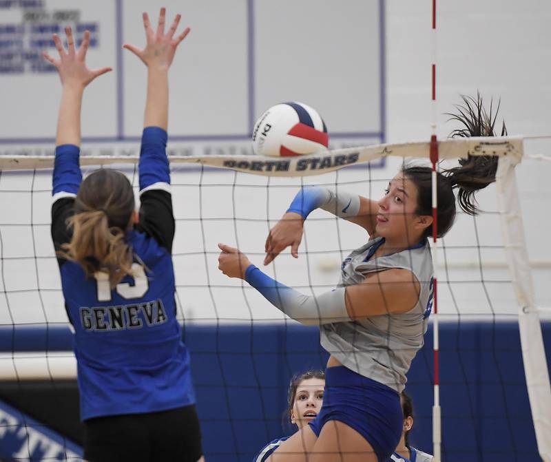 St. Charles North’s Haley Burgdorf hits against Geneva in a girls volleyball match in St. Charles in Tuesday, October 17, 2023.