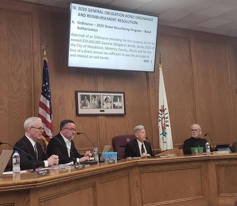 Woodstock Mayor Brian Sager discusses the intent to issue a three-cent gas tax and issuance of $10 million bond to a crowd of 20 people at Tuesday night's City Hall meeting.