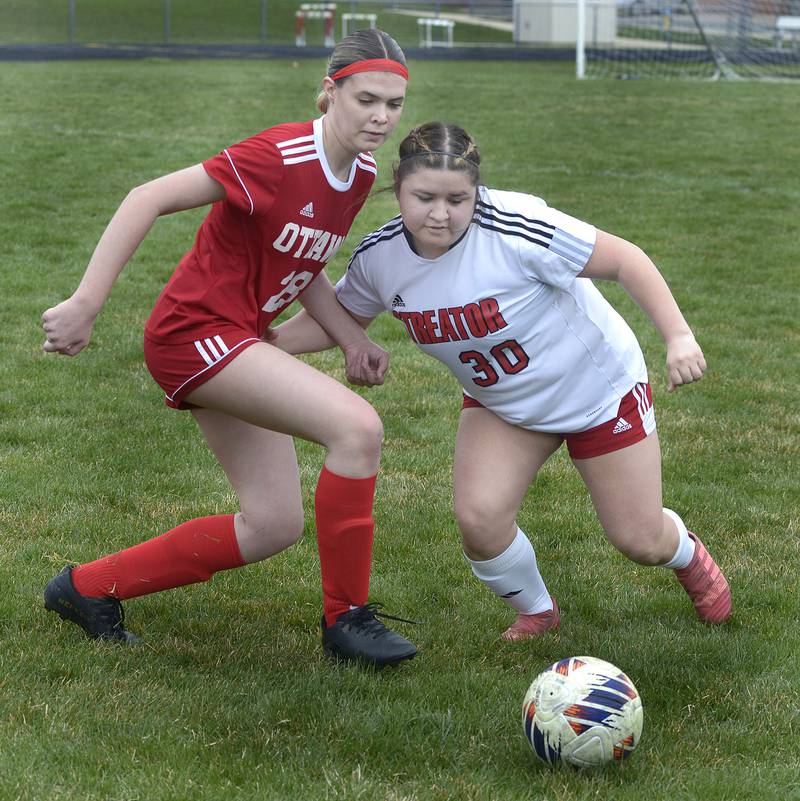 Ottawa’s Ayla Covalsky and Streator’s Iliana Gomez chase after a loose ball Saturday at Ottawa.