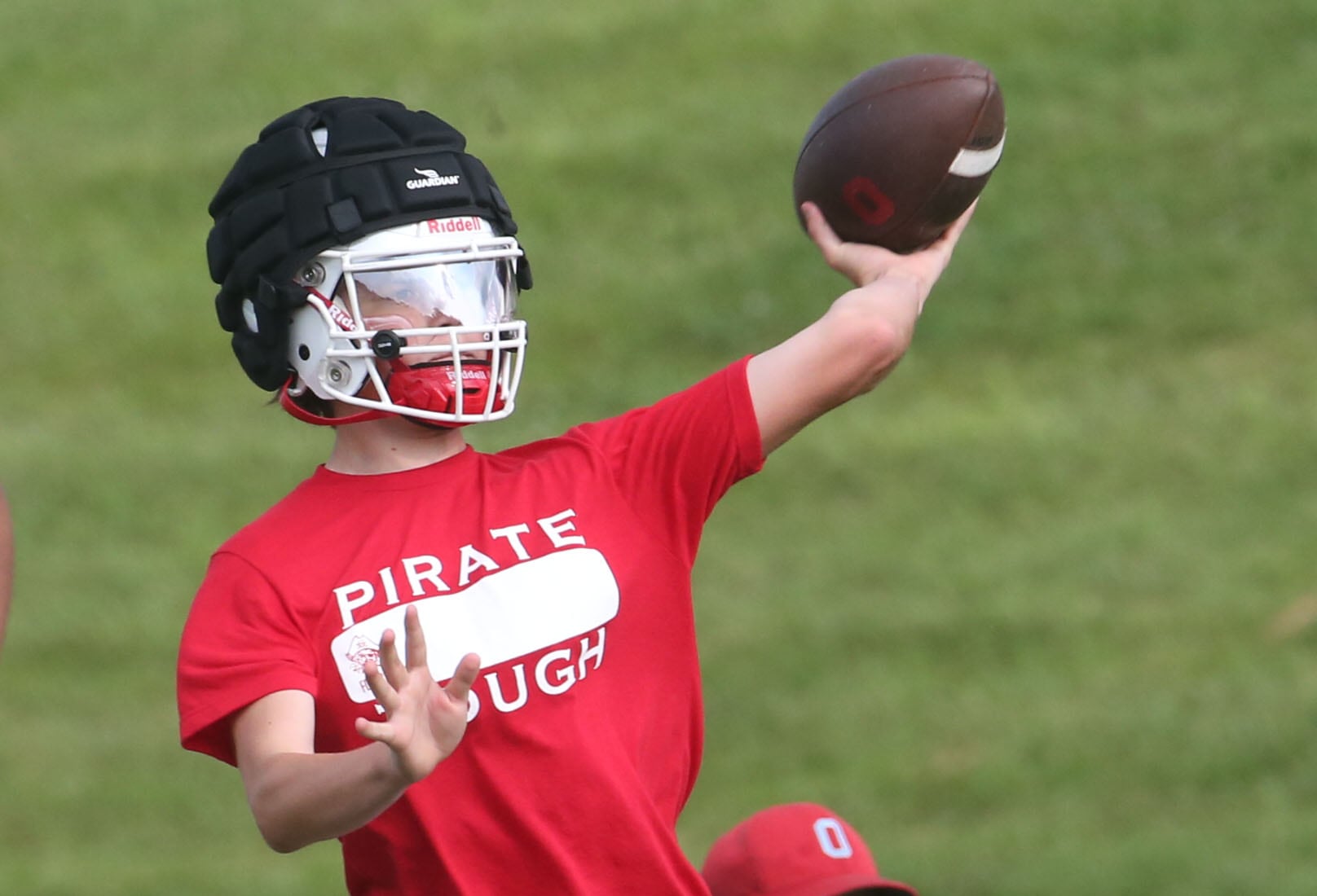 Ottawa quarterback Mark Munson throws a pass against St. Bede during a 7-on-7 scrimmage in mid-July at Ottawa High School.