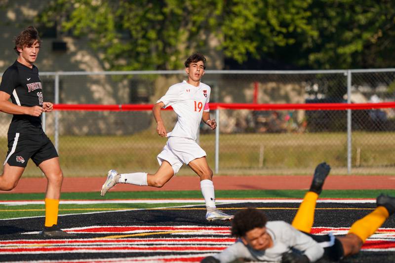 Oswego’s Lucas Ensign (19) watches his shot sail past Yorkville's Caleb Reveter (1) for a goal during a soccer match at Yorkville High School on Tuesday, Sep 17, 2024.