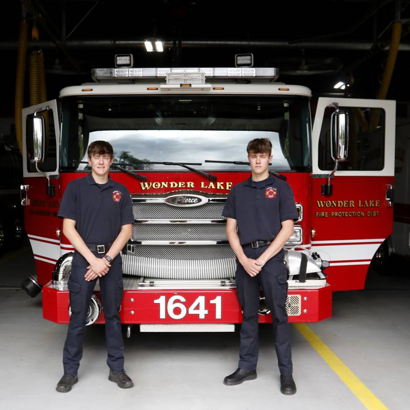 Twins Parker and Hunter Menzel, who will graduate from Woodstock North on Saturday, May 19, 2024, have already began working as Wonder Lake firefighters.