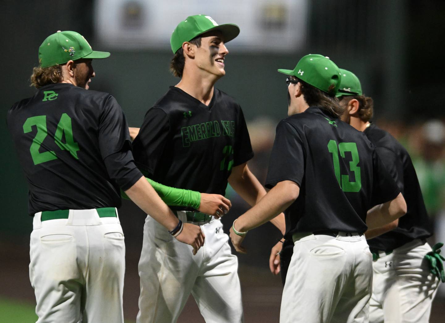 Providence starting pitcher Kasten Goebbert, middle, is greeted in front of the dugout by teammates after being removed from the game in the bottom of the seventh inning during the Class 4A state baseball championship game at Duly Health and Care Field on Saturday, June 8, 2024 in Joliet.