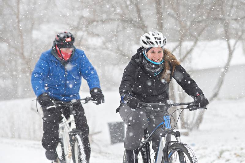 Dawn and Matt Moore lead the group of BJ and wife Pam Fenwick and Joe Fenwick as they head towards Lowell Park during their annual New Years ride on Jan. 01, 2022.