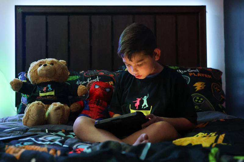 Jorgie Espinoza, 10-years old, sits on the bed of his newly renovated bedroom. Jorgie, who is battling cancer, won an extreme bedroom makeover from Special Places, an organization creating dream bedrooms for children with cancer on Tuesday, Sept. 12, in Joliet.