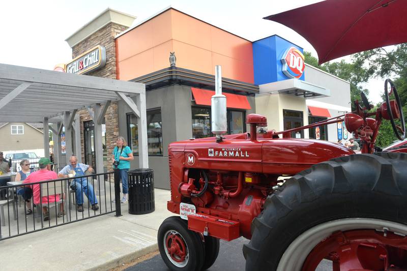 A 1950 Farmall tractor owned by Hank and Cindy Gerdes of Amboy sits in the parking lot at the Oregon Dairy Queen at the midway point in the took part in the Living History Antique Equipment Association's tractor drive on Saturday  About 40 tractors took part in the ride that started at the association's show grounds in Franklin Grove and traveled to Oregon and back.