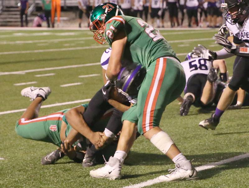 Plano's Nevin Butcher is brought down by L-P's Nolan Glynn and Josh Senica on Friday, Sept. 15, 2023 at Howard Fellows Stadium.