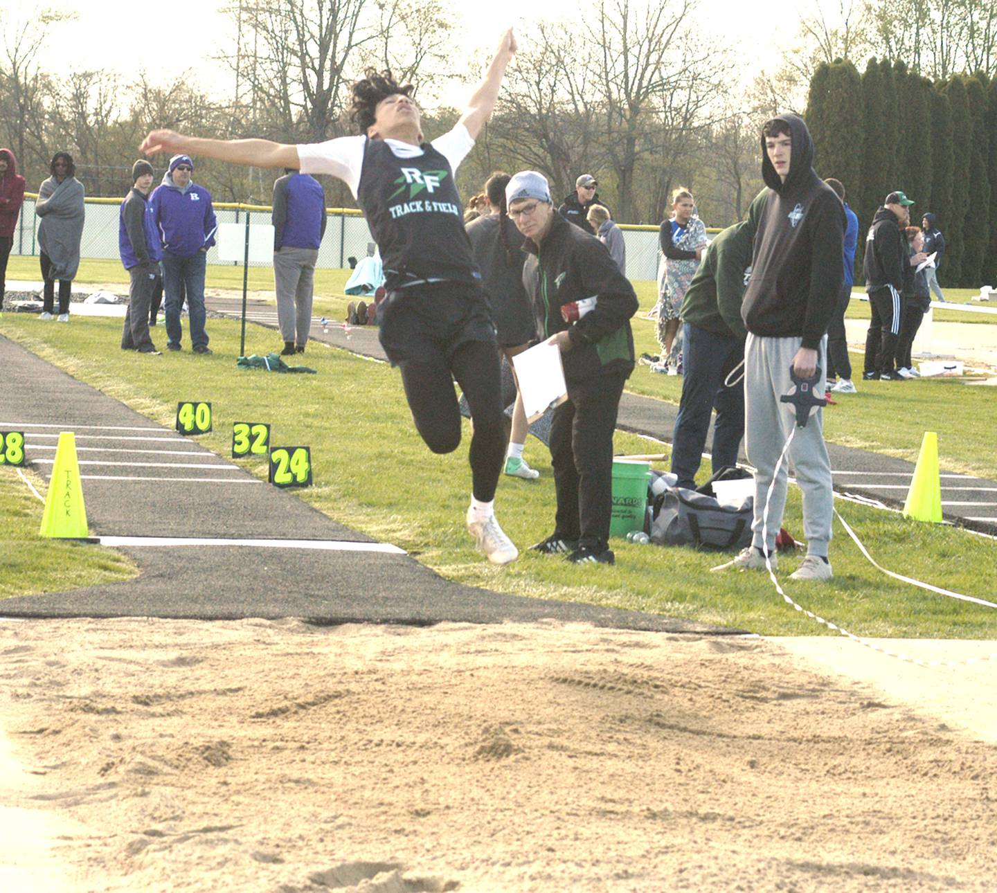 Rock Falls' Cristian Hernandez competes in the long jump at the Rock Falls Rocket Invite at Hinders Field on Friday, April 19, 2024.