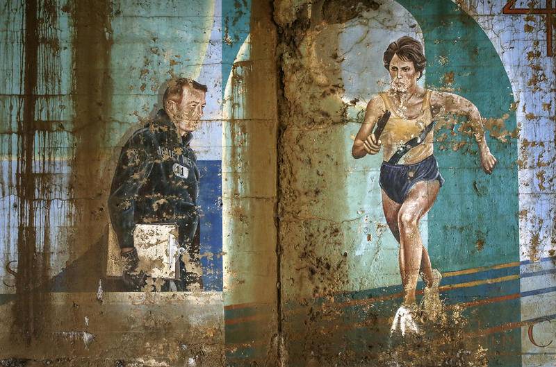 Dilapidated murals of local Joliet sports icons sit in a state of decay June 13, 2017, in downtown Joliet. One task facing the new Joliet Arts Commission could be decisions on what to do about the city's fading murals.