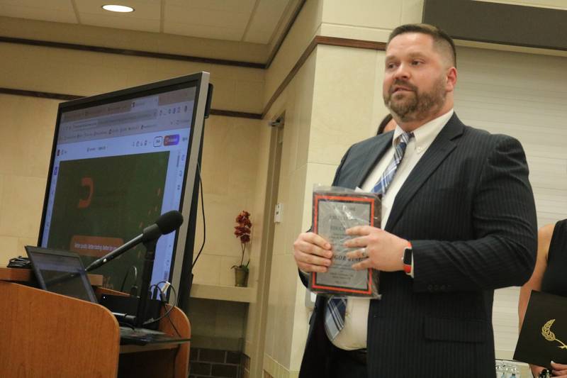 Clinton Rosette Middle School choir director Gregory King gives remarks at the May 7, 2024, meeting of the DeKalb School District 428 board.