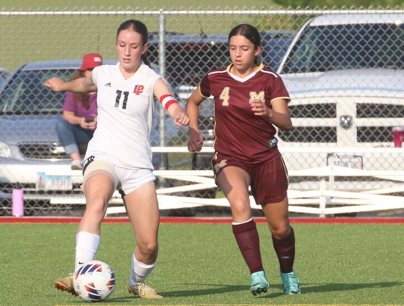 L-P's Danica Scoma keeps the ball away from Morris's Zara Lugo during the Class 2A Regional semifinal game on Wednesday, May 15, 2024 at the L-P Athletic Complex in La Salle.