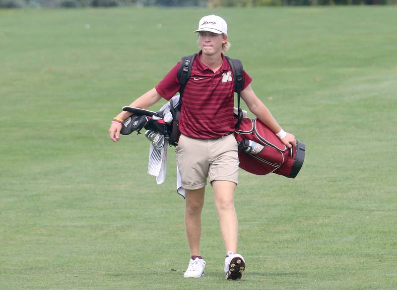 Morris's Liam Eber carries his clubs while competing during the Pirate Invitational golf meet on Monday, Sept. 16, 2024 at Deer Park Golf Course in Oglesby.