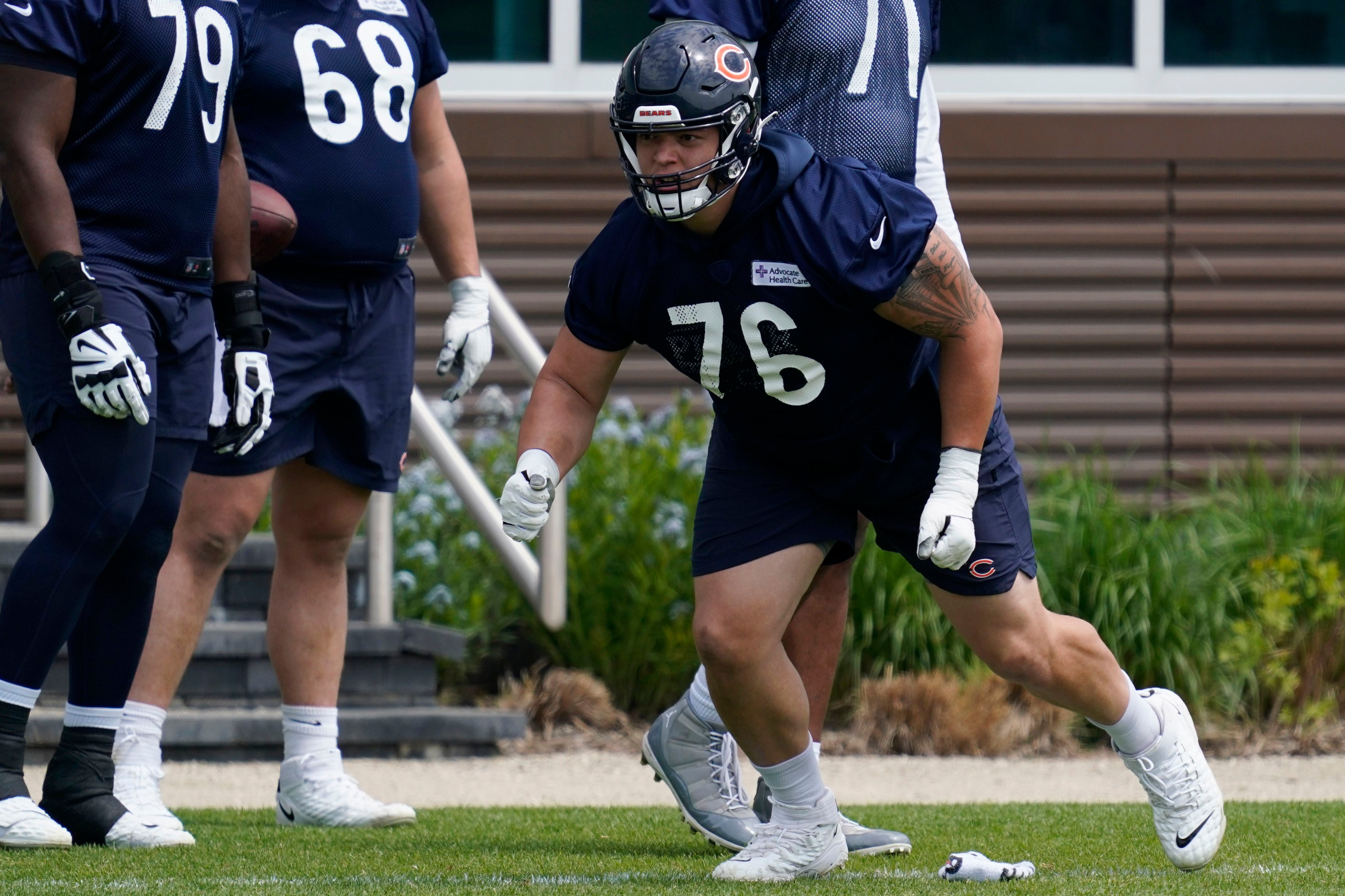 Chicago Bears offensive tackle Teven Jenkins (76) runs off the