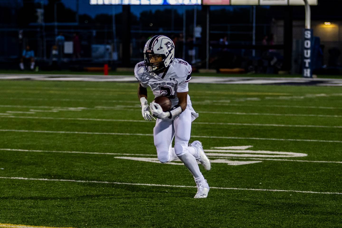 Plainfield North's Darin Ashiru runs downfield against Plainfield South on Sept. 13, 2024.