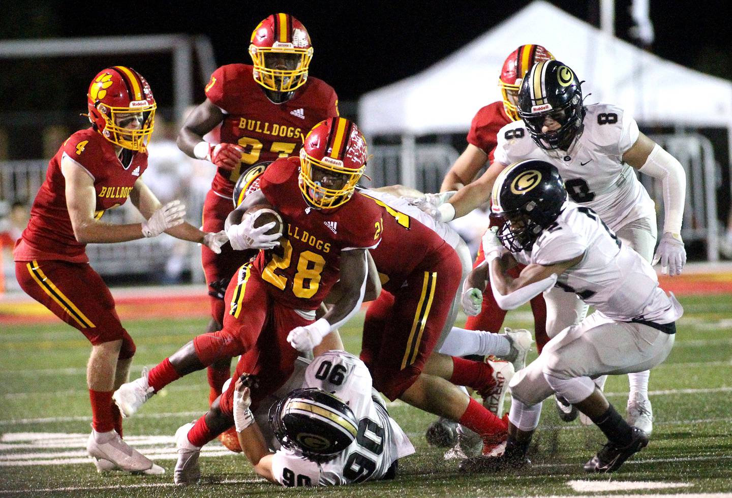 Batavia's AJ Sanders (28) carries the ball during a home game against Glenbard North on Friday, Sept. 24, 2021.