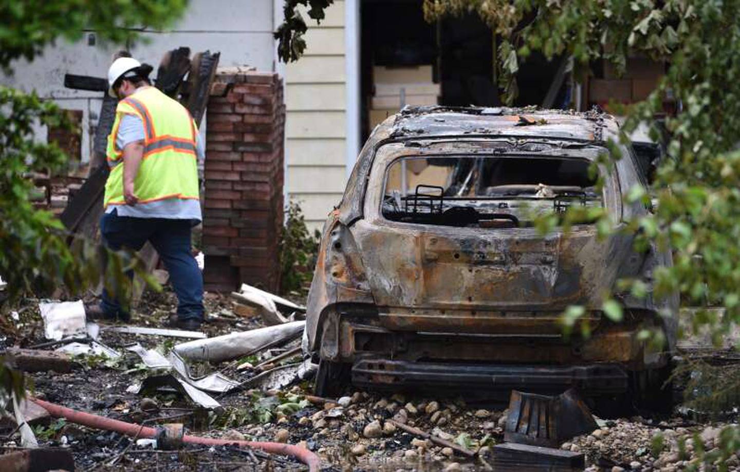 A vehicle was incinerated Tuesday, June 4, 2024, when a house in the 23500 block of North Overhill Road near Lake Zurich exploded. One person was found dead inside the house, authorities
