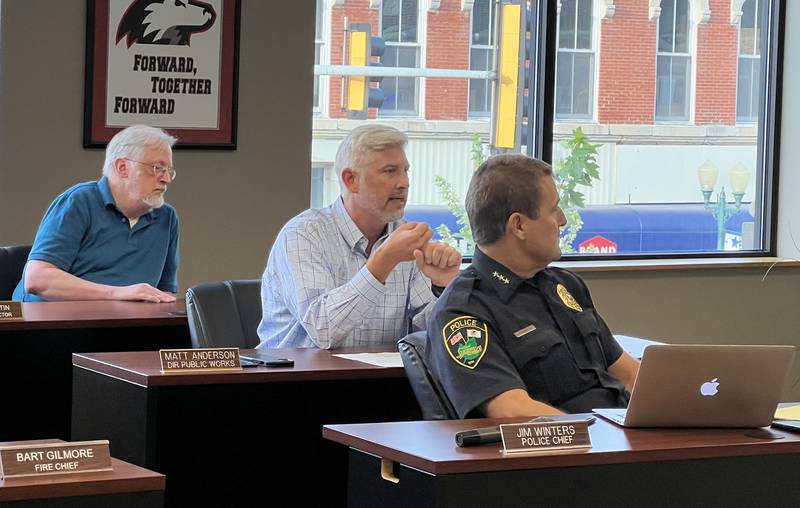 Director of Sycamore Public Works Matt Anderson, middle, talks during the Sept. 5, 2023 Sycamore City Council meeting as Finance Director Brien Martin, left, and Sycamore Chief of Police Jim Winters, right, listen.