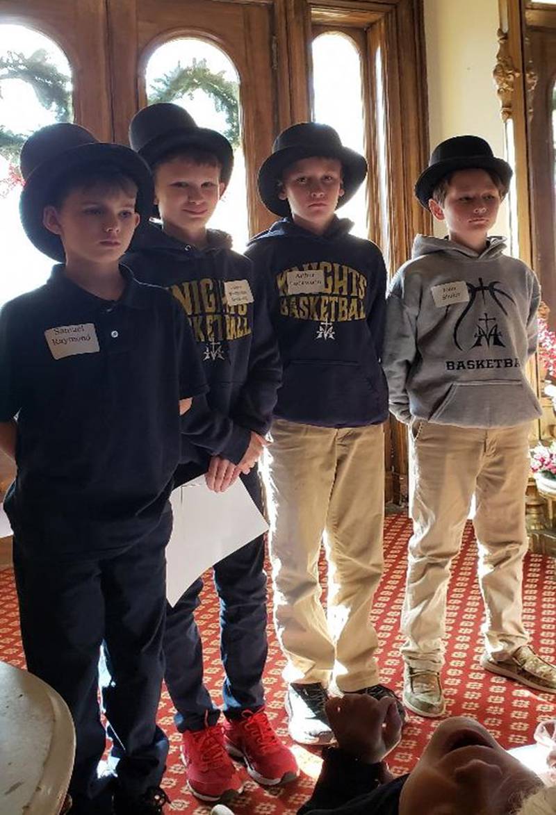 As part of their tour of the Reddick Mansion, these Marquette Academy fifth graders portraying Ottawa Mayor Joseph Glover, Abraham Lincoln, Stephen A. Douglas and William Reddick reenacted the first Lincoln-Douglas debate.  Their classmates portrayed the 10,000 or so people gathered in Washington Square directly across the street from the mansion on the day of the debate.