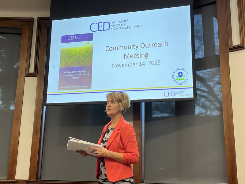 Kristin Erickson, economic development project manager for Will County Center For Economic Development, speaks at a community outreach meeting regarding brownfields on Tuesday, Nov. 14, at the Joliet Public Library's Ottawa Street branch.