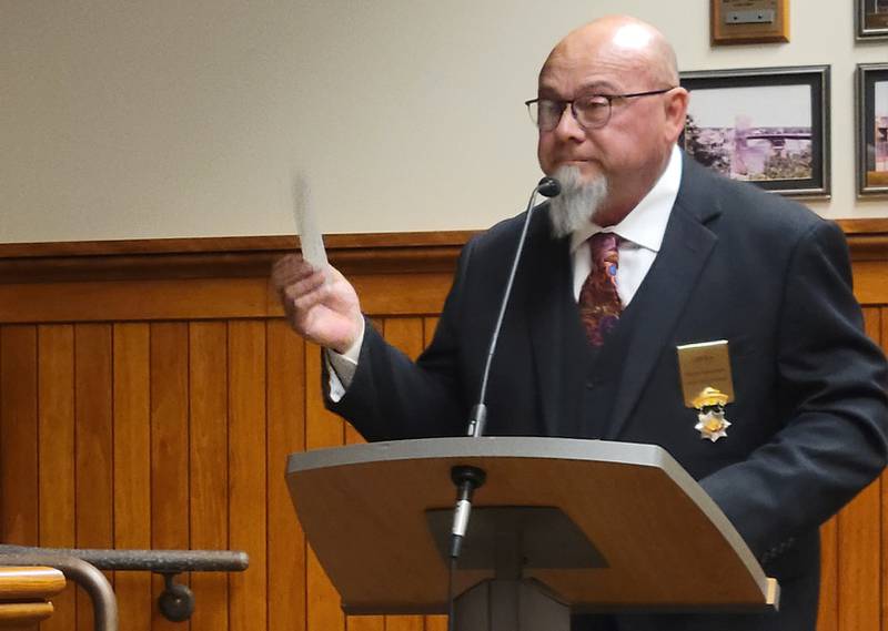 Ray Jackson, Deputy Grand Master of the Independent Order of Odd Fellows of Illinois, on Tuesday night presents to the Ottawa City Council a check for $3,000 from his organization to benefit the city's parks.