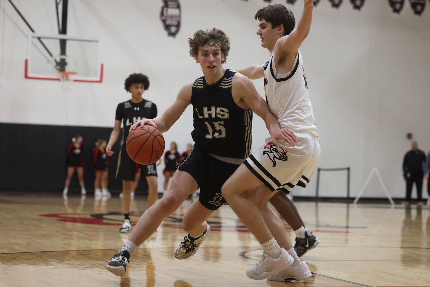 Lemont’s Shea Glotzbach drives around Lincoln-Way Central’s Logan Baechtold on Wednesday, Jan. 10th, 2024 in New Lenox.