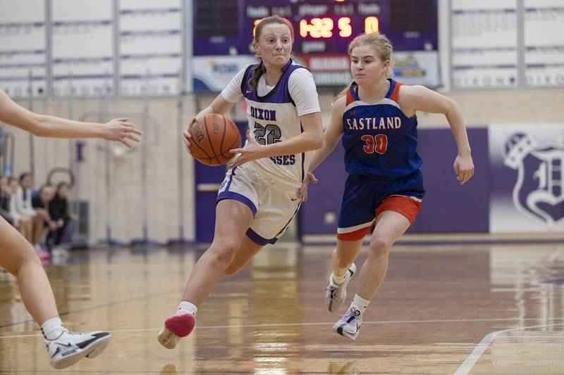 Dixon’s Katie Drew drives to the hoop past Eastland’s Morgan McCullough Wednesday, Jan. 24, 2024 at Dixon High School.