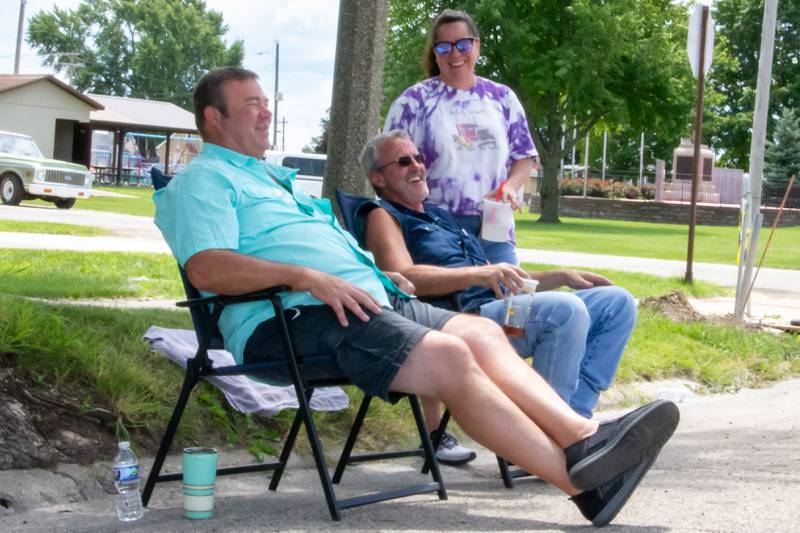 (Left) Craig DeReu, (Middle) Doug Cantwell and (Right) Polly Cantwell enjoy the Convoy Against Cancer Big Truck Show on Saturday, July 20, 2024 on Main Avenue in Ladd.