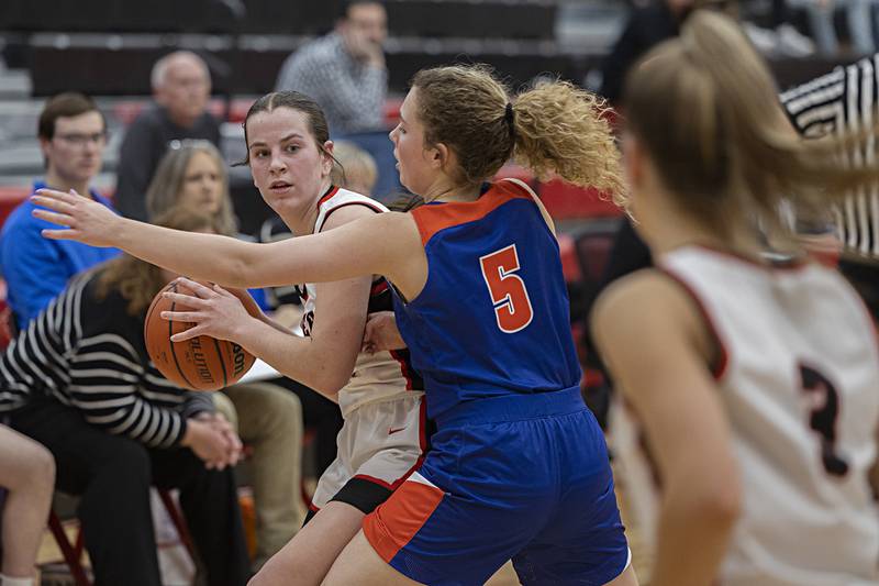 Amboy’s Addison Pertell looks to pass while being guarded by Eastland’s Jenica Stoner Friday, Jan. 19, 2024 at Amboy High School.