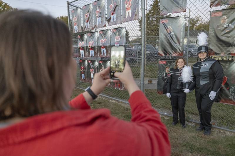 Drum Majors Madelyn Reum (right) and Kylie Nettleingham (left) pose near their banners at senior night prior to the game at Doug Dieken Field on October 18, 2024.