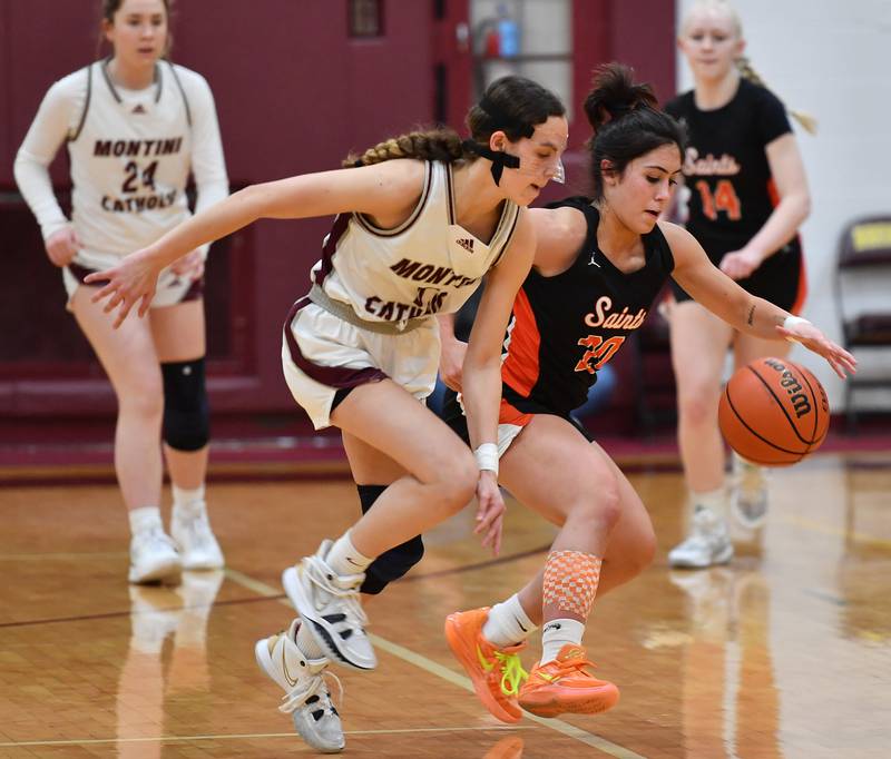 Montini's Nicolette Kerstein and St. Charles East's Alexis Maridis (20) contend for the ball during the Montini Christmas Tournament championship game on Dec. 29, 2023 at Montini Catholic High School in Lombard.