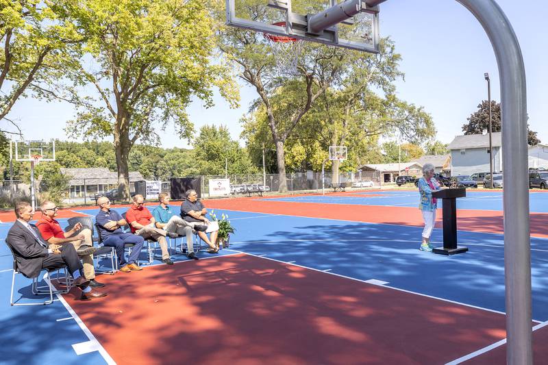 Louise Reed says a few words Tuesday, Sept. 17, 2024, about the dedication of the new basketball courts named after her and late husband Larry.