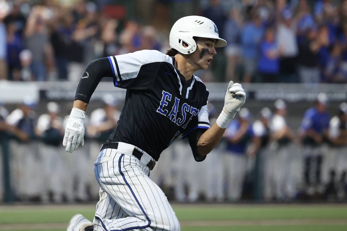 Lincoln-Way East’s Tyler Bell looks to round first on a 2-run double against Brother Rice in the Class 4A Crestwood Supersectional on Monday, June 5, 2023 in Crestwood.