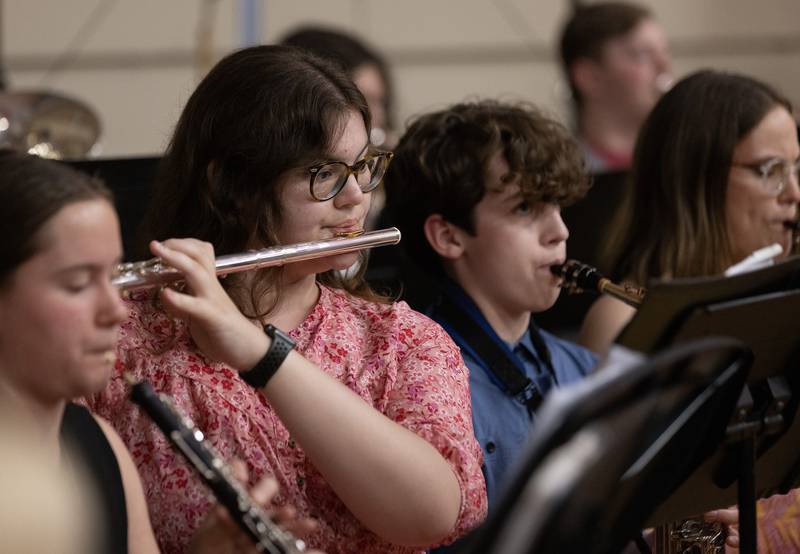 Streator High School junior and band member Madilyn Reum plays the flute while the band performs "Pomp and Circumstance" on Sunday, May 19, 2024, in the school gym during the commencement ceremony.