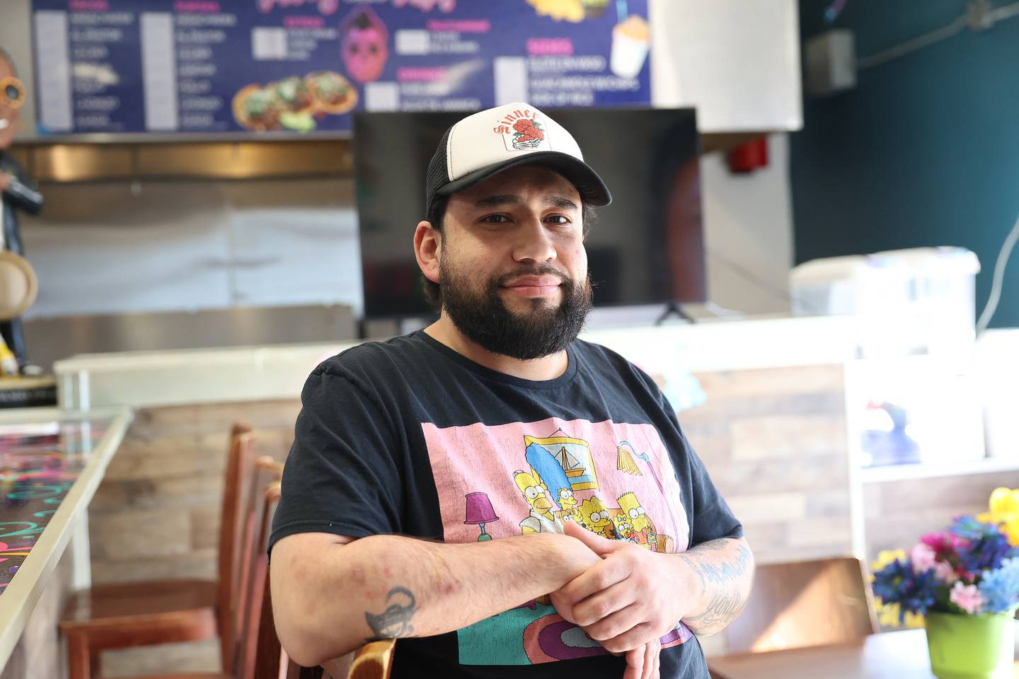 Tacos Before Vatos owner Marco Alcantar poses for a photo at his Joliet restaurant.