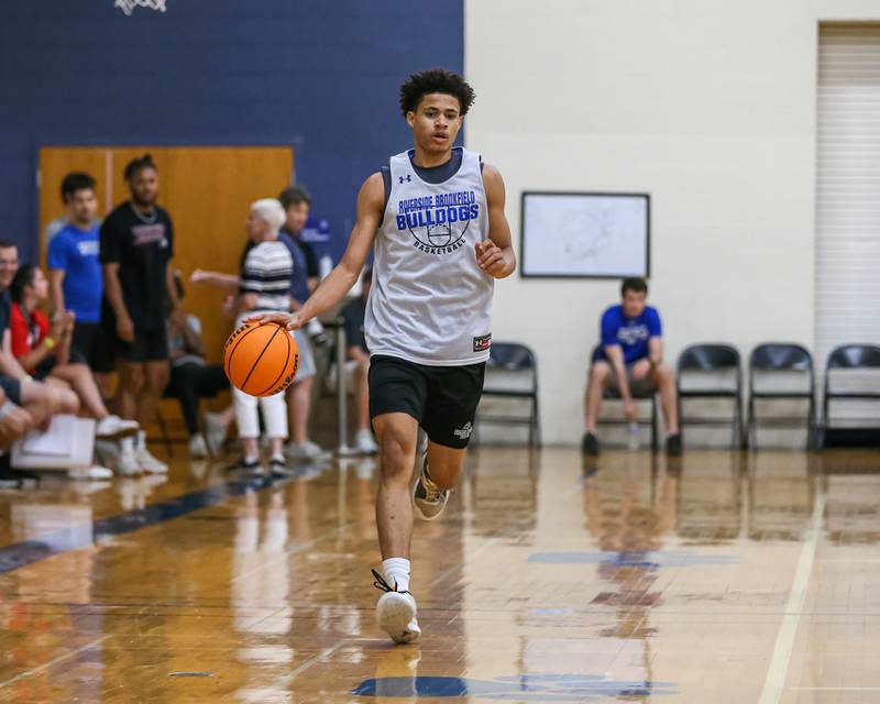 Riverside-Brookfield's Cameron Mercer advances the ball at the Riverside-Brookfield Summer Shootout basketball tournament. June 22, 2024.