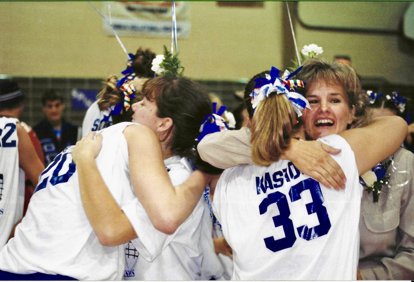 Former Princeton coach Rita Placek receives a hug from PHS' Angie Kastor during the 1998 volleyball season.