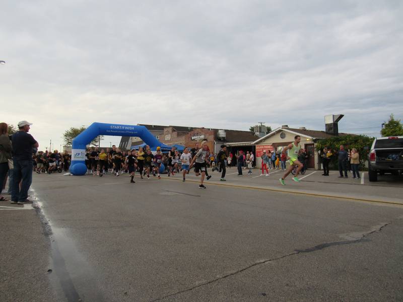 Runners take off from the starting line for the Megan's Mission 5K.