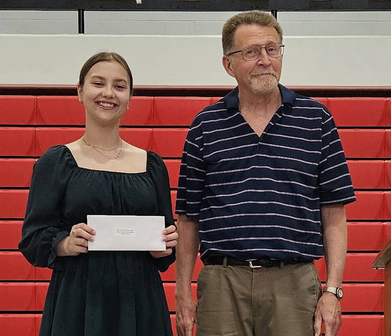Ron Armstrong presents the Kiwanis Service to Learn Dave Goerne Scholarship to Lanee Lucas.
