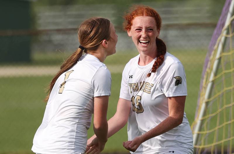 Sycamore's Izzie Segreti (right) celebrates her goal with teammate Lizzie Goff during their Class 2A sectional semifinal game Tuesday, May 21, 2024, at Belvidere High School.