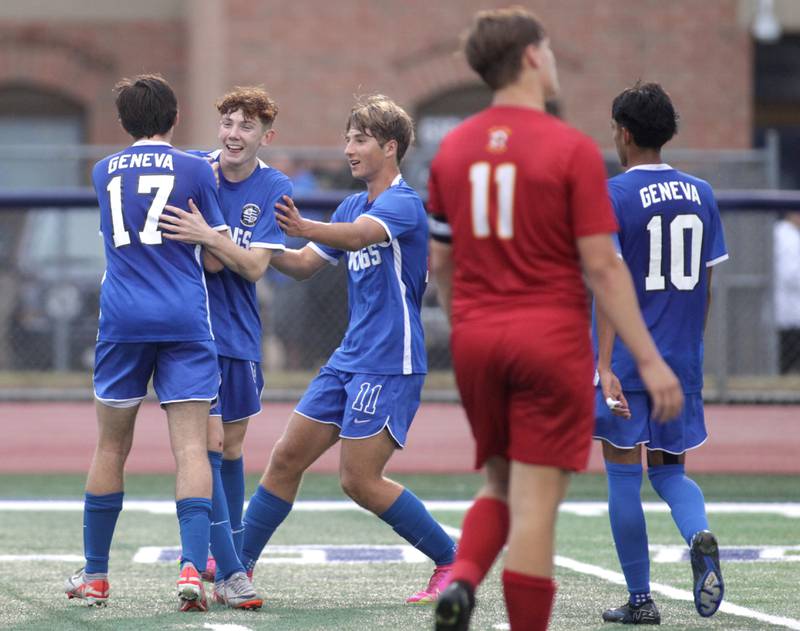 Geneva players celebrate a goal by Reece Leonard (second from left) during a Tri-Cities Night game against Batavia at St. Charles North High School on Thursday, Sept. 21, 2023.