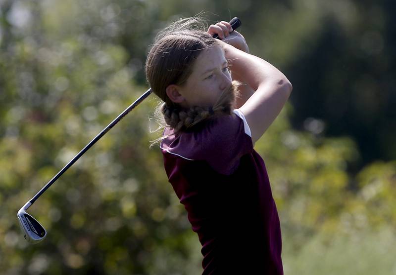 Marengo’s Maggie Hanson watches her tee shot on the 7th hole of Valley course during the McHenry County Tournament on Thursday, Sept.12, 2024, at Boone Creek Golf Club in Bull Valley.