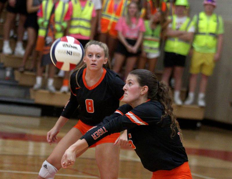 Crystal Lake Central’s Mia Ginter, left, watches as Mykaela Wallen passes the ball during a Fox Valley Conference volleyball match on Tuesday, Aug. 27, 2024, at Huntley High School.