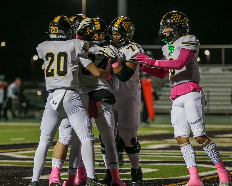 Joliet West celebrates a touchdown run by Tai’vaughn Johnson (34) during a 2023 football game between Joliet West and Plainfield Central.