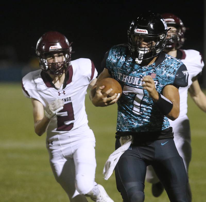 Woodstock North's Parker Halihan is chased by Marengo's Cooper Lopez as runs with the ball during a Kishwaukee River Conference football game on Friday, Sept. 13, 2024, at Woodstock North High School.