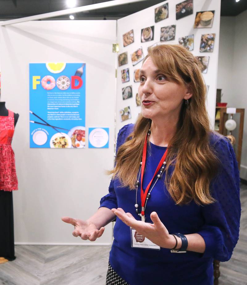 Michelle Donahoe, executive director of the DeKalb County History Center, talks Thursday, June 6, 2024, about the new exhibit “Food: Gathering Around the Table,” now open at the center in Sycamore. The exhibit was created by the DeKalb County History Center in collaboration with the Smithsonian Institution's Museum on Main Street program.