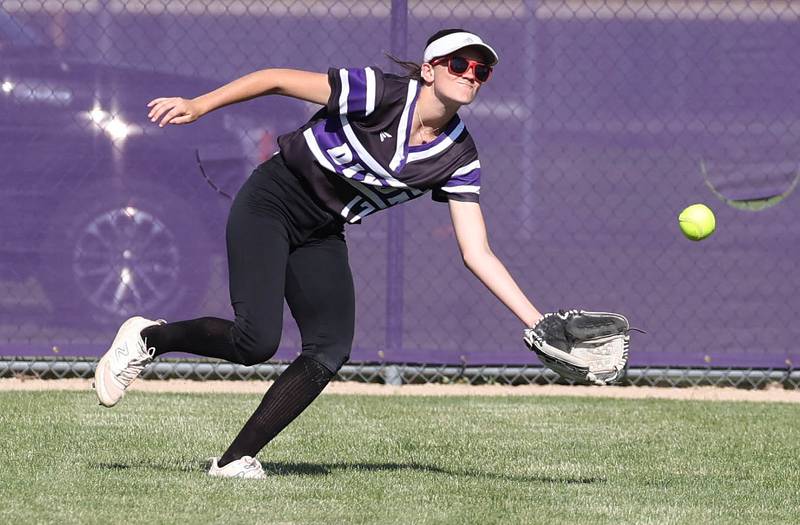 Dixon’s Kiley Gaither tries to make a running catch during their Class 3A regional championship game against Sycamore Thursday, May 23, 2024, at Rochelle High School.