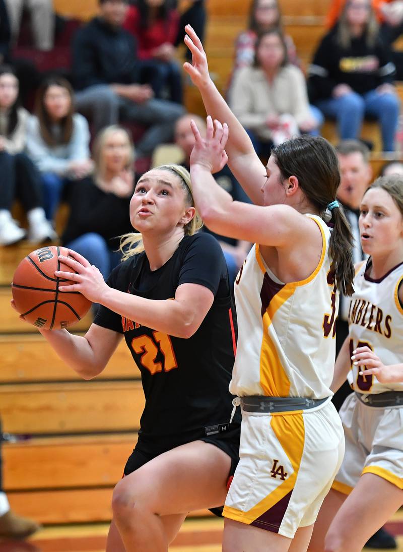 Batavia's Kylee Gehrt (21) goes to the basket during a Coach Kipp Hoopsfest game against Loyola Academy on Jan. 13, 2024 at Montini Catholic High School in Lombard.