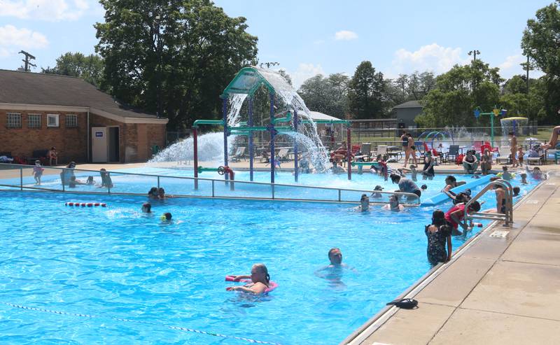 Children cool off in the water on Monday, June 17, 2024 at the Riordan Pool in Ottawa.